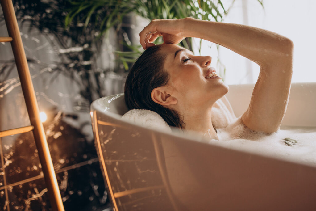 Woman relaxing in bath with bubbles